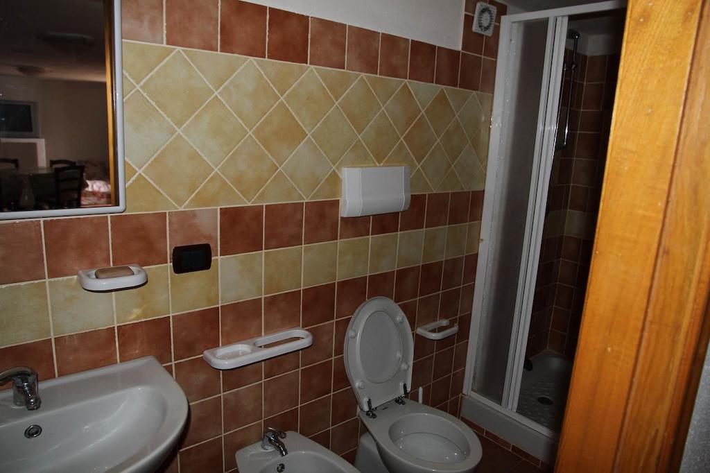 Addisora Appartamenti Cala Liberotto Habitación foto